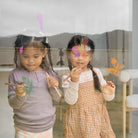 Honeysticks Magic 3-in-1 beeswax crayon set with jumbo triangle-shaped crayons in a 10-pack for kids' art projects.