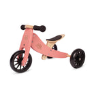Kinderfeets Tiny Tot Coral balance bike for toddlers with a sturdy wooden frame and colorful design, perfect for early riding skills