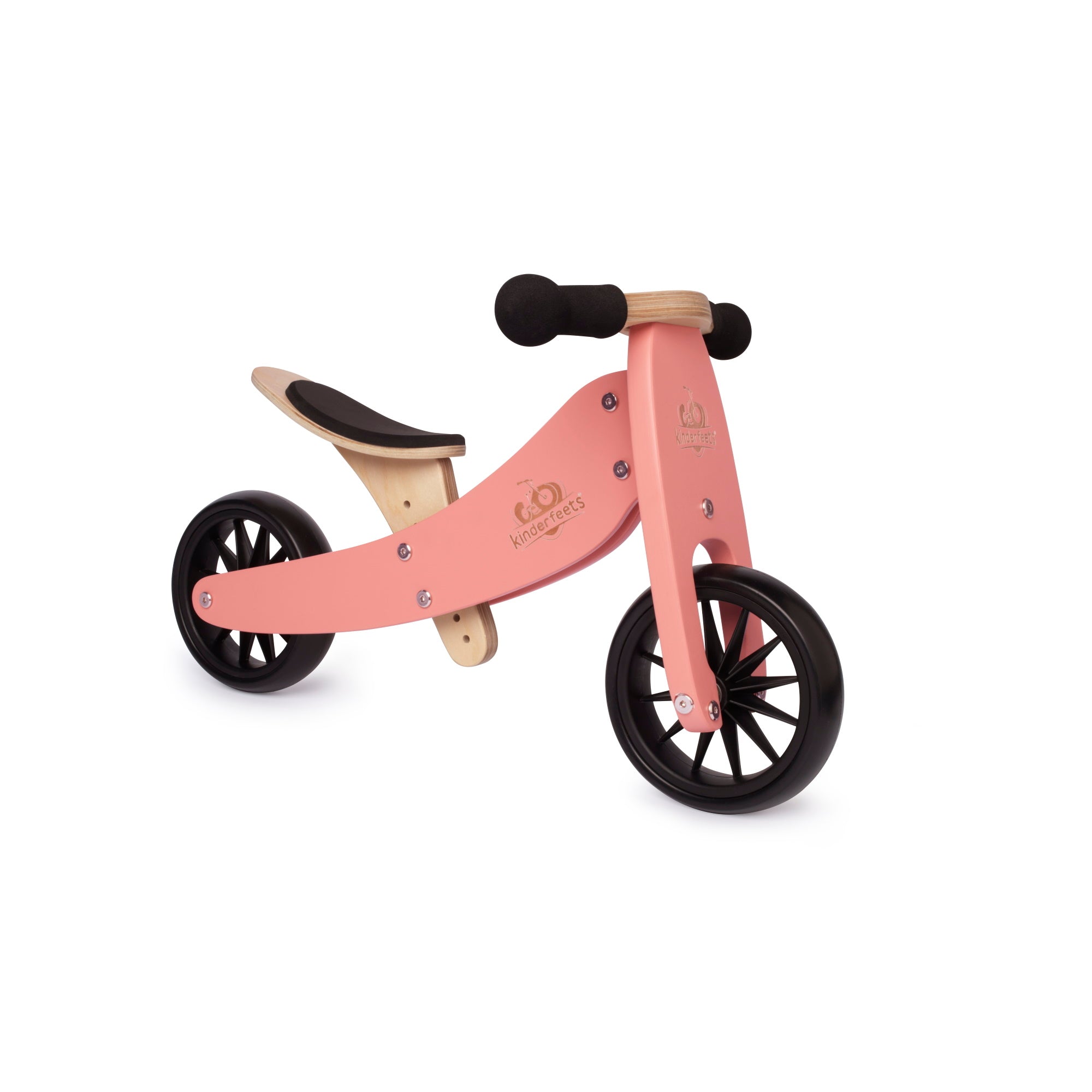 Kinderfeets Tiny Tot coral trike and balance bike for toddlers, featuring a sturdy wooden frame and colorful design.