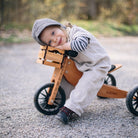 Kinderfeets wooden crate used as a balance bike storage container, featuring a natural wood finish and sturdy construction.