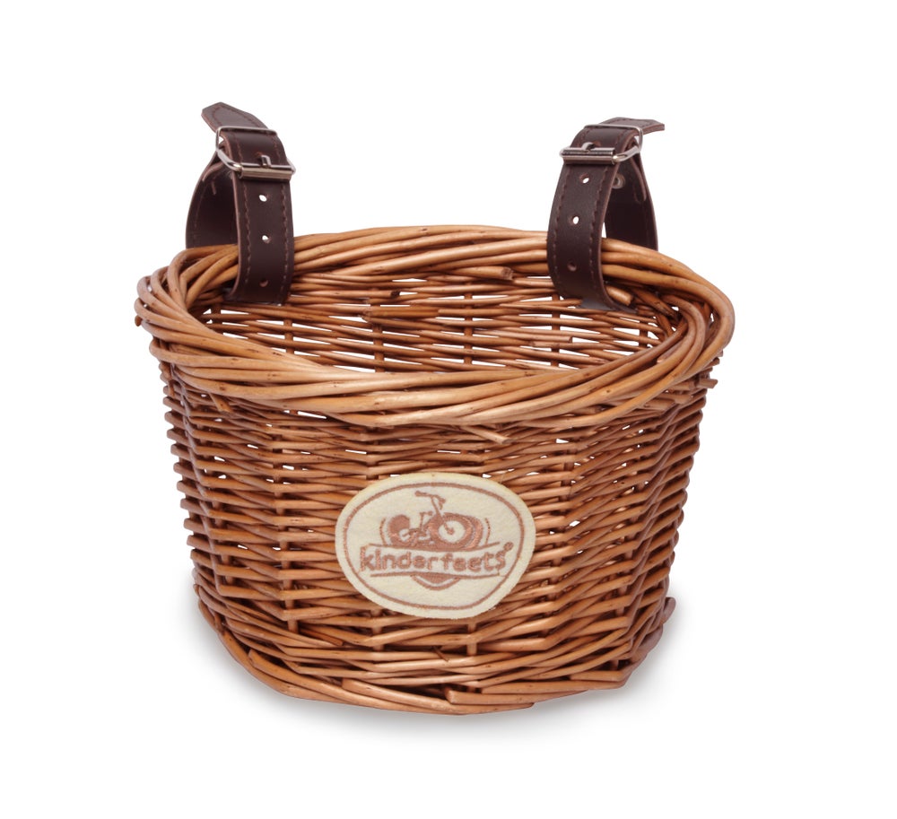 Kinderfeets wicker basket mounted on a balance bike, showcasing natural woven material and child-friendly design.