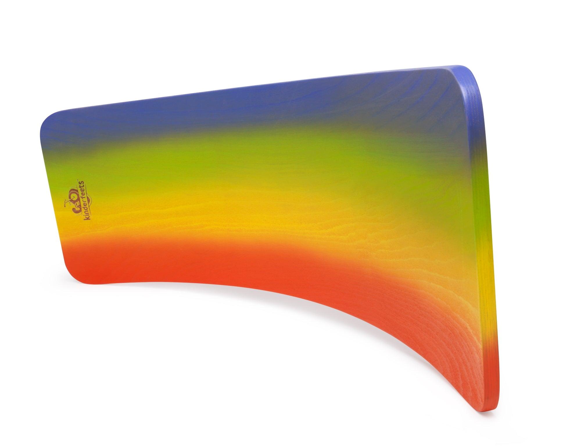 Kinderfeets Rainbow Kinderboard balance board with colorful rainbow design on smooth wooden surface.