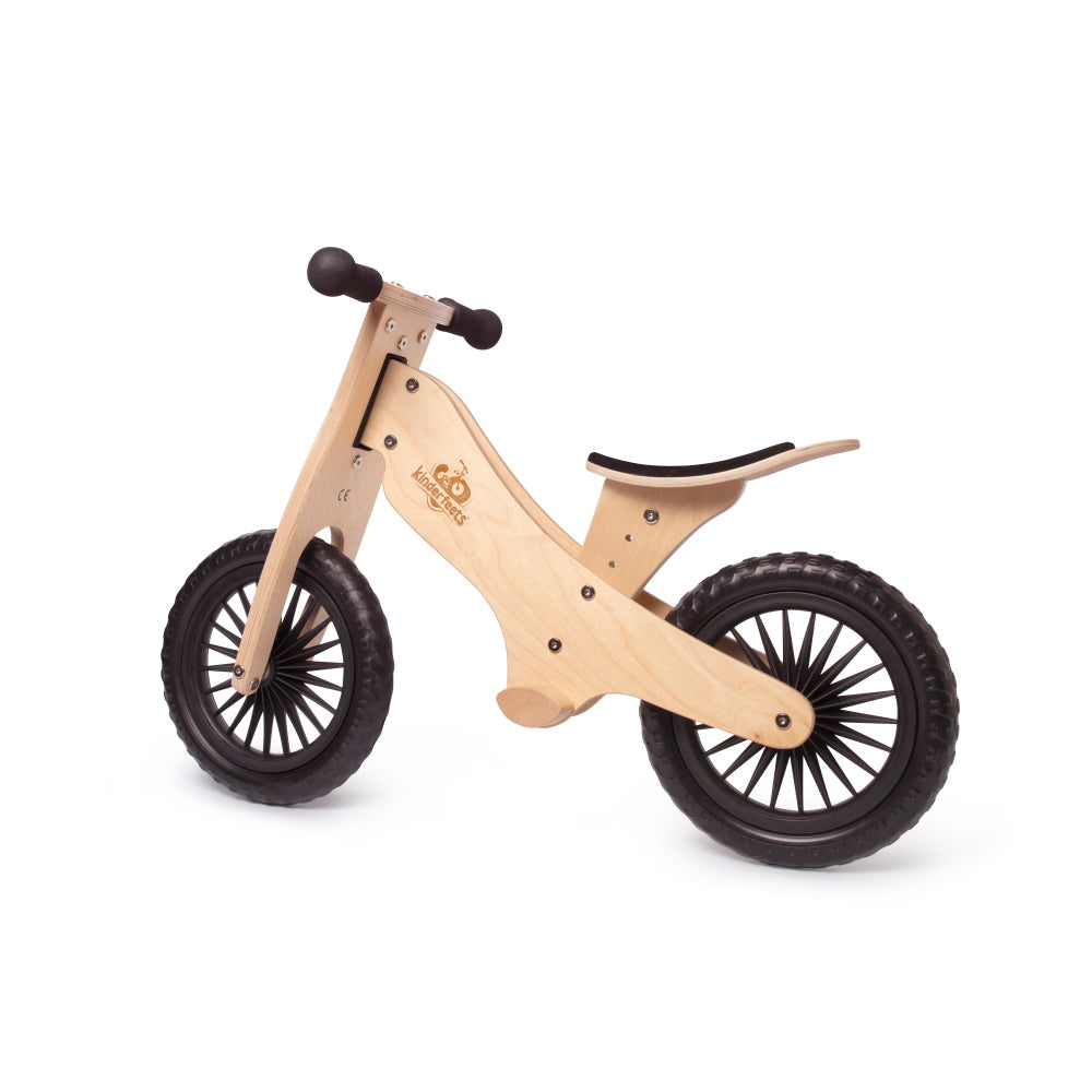 Kinderfeets natural balance bike for kids, shown from the left side, lightweight wooden frame with handlebar and pedalless design.