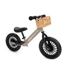 Kinderfeets Trail Bike in slate grey, a balanced bike designed for young children, shown from the right side on a crate.