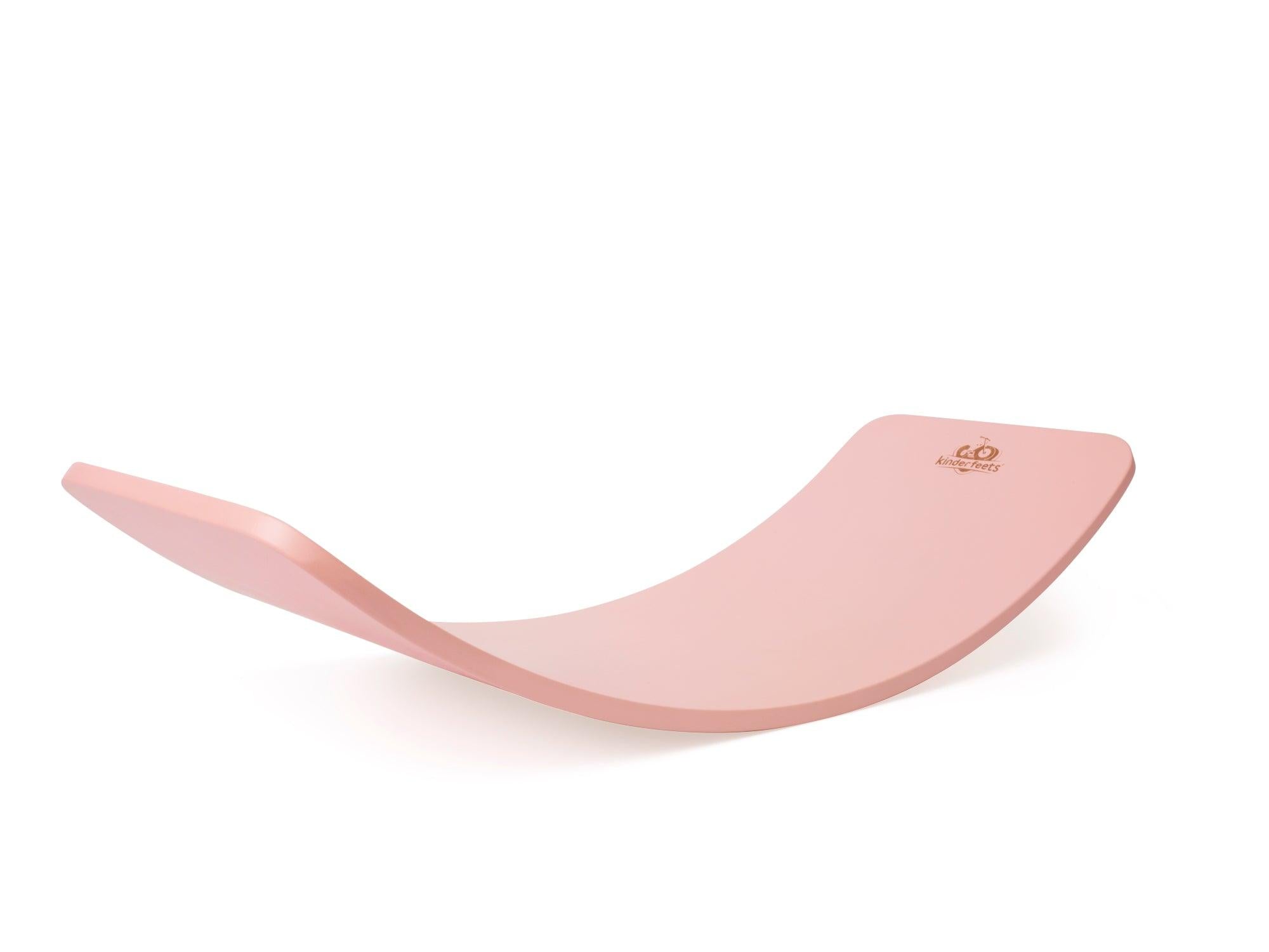 Kinderfeets Kinderboard balance board in pink rose color, featuring a smooth wooden surface and rounded edges for stability.