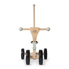 Kinderfeets Tiny Glider toy in vibrant colors, featuring a wooden frame and smooth wheels for young children to ride and play.