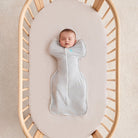 Love To Dream Swaddle Up™ Original 1.0 TOG in grey, a soft fabric swaddle for babies, shown laid flat with arms in.