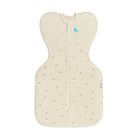 Love To Dream Swaddle Up All Seasons 1.5 TOG in Twigs, a soft baby swaddle with a leafy pattern, designed for comfortable sleep.
