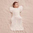 Love to Dream Swaddle Up Transition Bag Bamboo 1.0 TOG in Lemons, showing soft fabric and secure arm openings for easy swaddling.