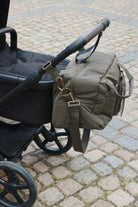 Konges Slojd All You Need Bag in moss grey fabric with leather handles, stylish and functional accessory for everyday use.