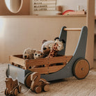 Kinderfeets Cargo Walker wooden toy in slate blue, featuring a sturdy design with cargo compartments for young children's play.