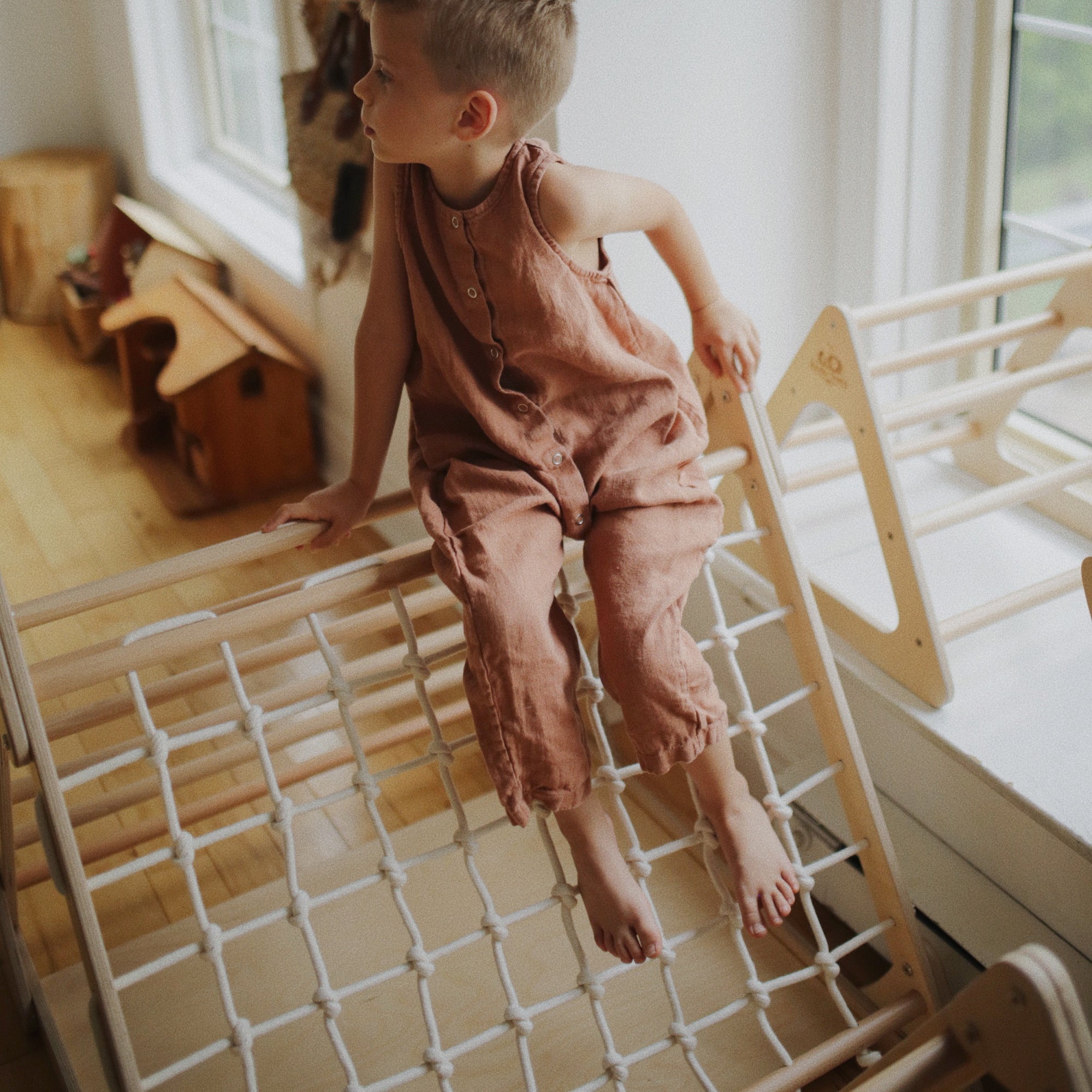Kinderfeets Pikler Triangle large triple climber climbing toy with wooden frame and colorful grips, designed for safe indoor play.