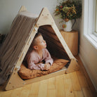 Large Kinderfeets Pikler Triangle climbing toy with three wooden climbing arches for young children to develop coordination and balance.