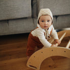 Kinderfeets Pikler climbing and rocking arch, wooden climbing toy with smooth finish for children’s play and development.