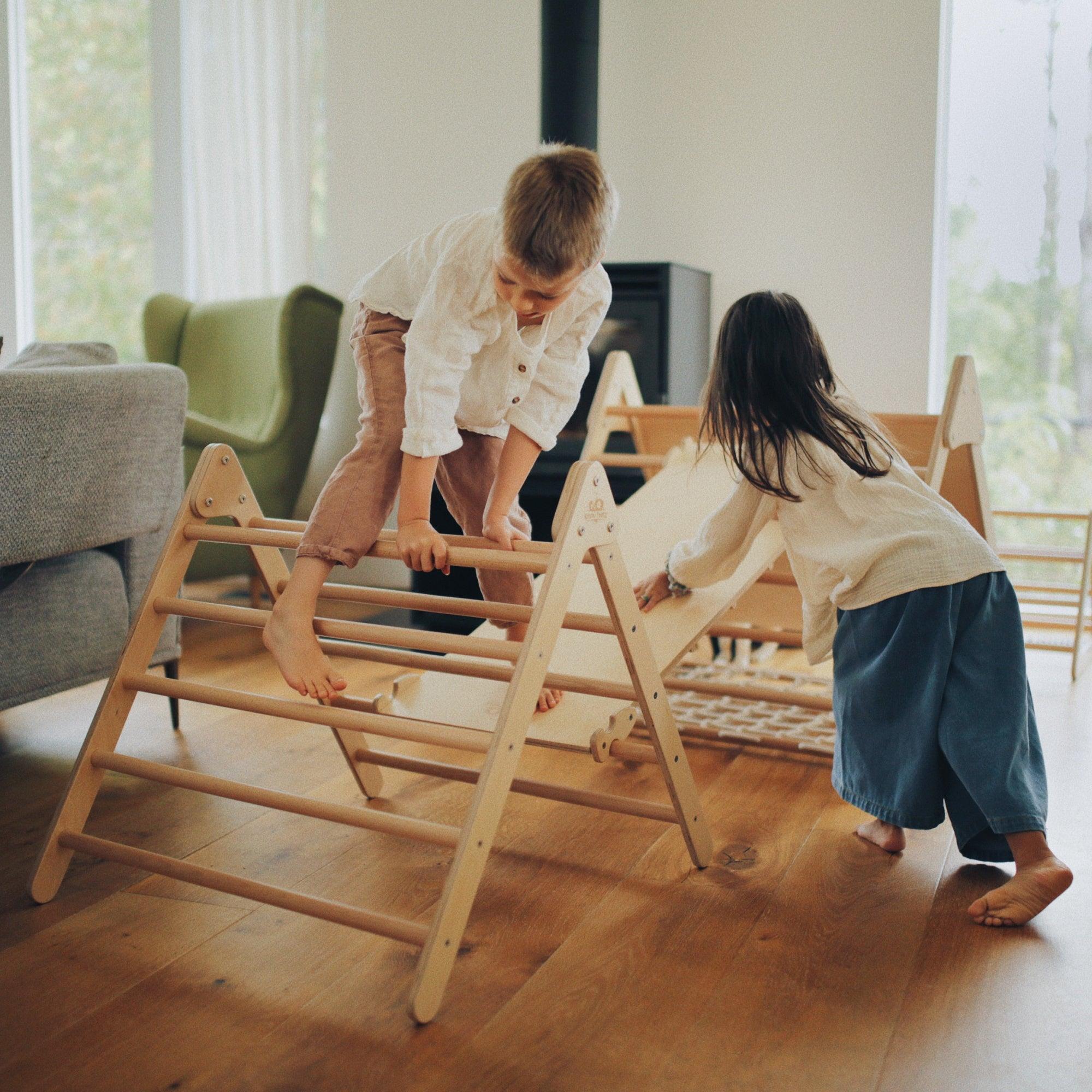 Kinderfeets Pikler Triangle climbing toy in medium size, featuring natural wooden bars for safe indoor play and development.