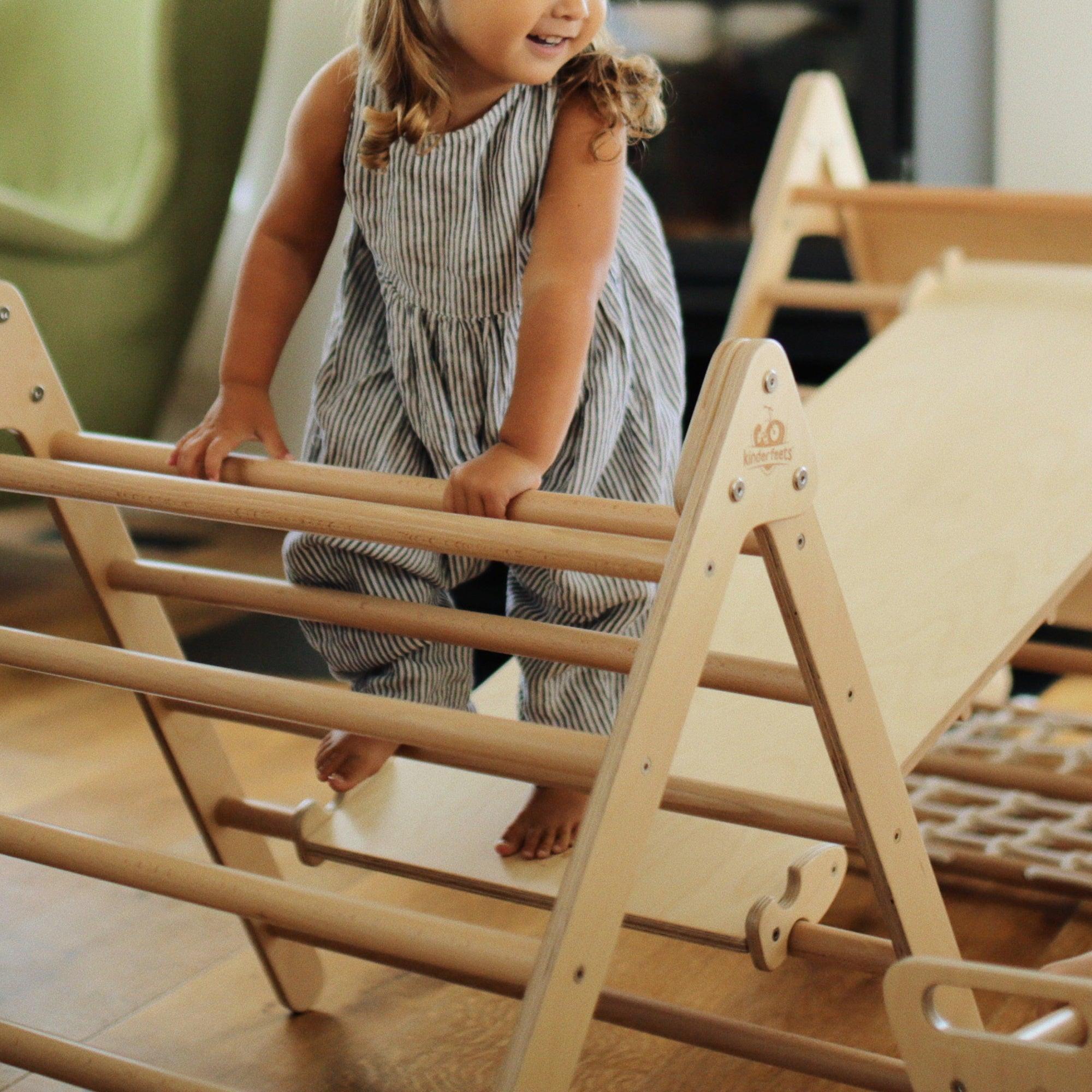 Kinderfeets Pikler Triangle climbing toy in medium size, featuring wooden frame and colorful rungs for safe indoor play.