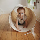 Kinderfeets Pikler Play Tunnel in vibrant colors, designed for children to crawl and play safely and comfortably.
