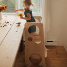 Kinderfeets Pikler Learning Tower in natural wood finish, sturdy wooden toddler step stool for safe climbing and independent play.