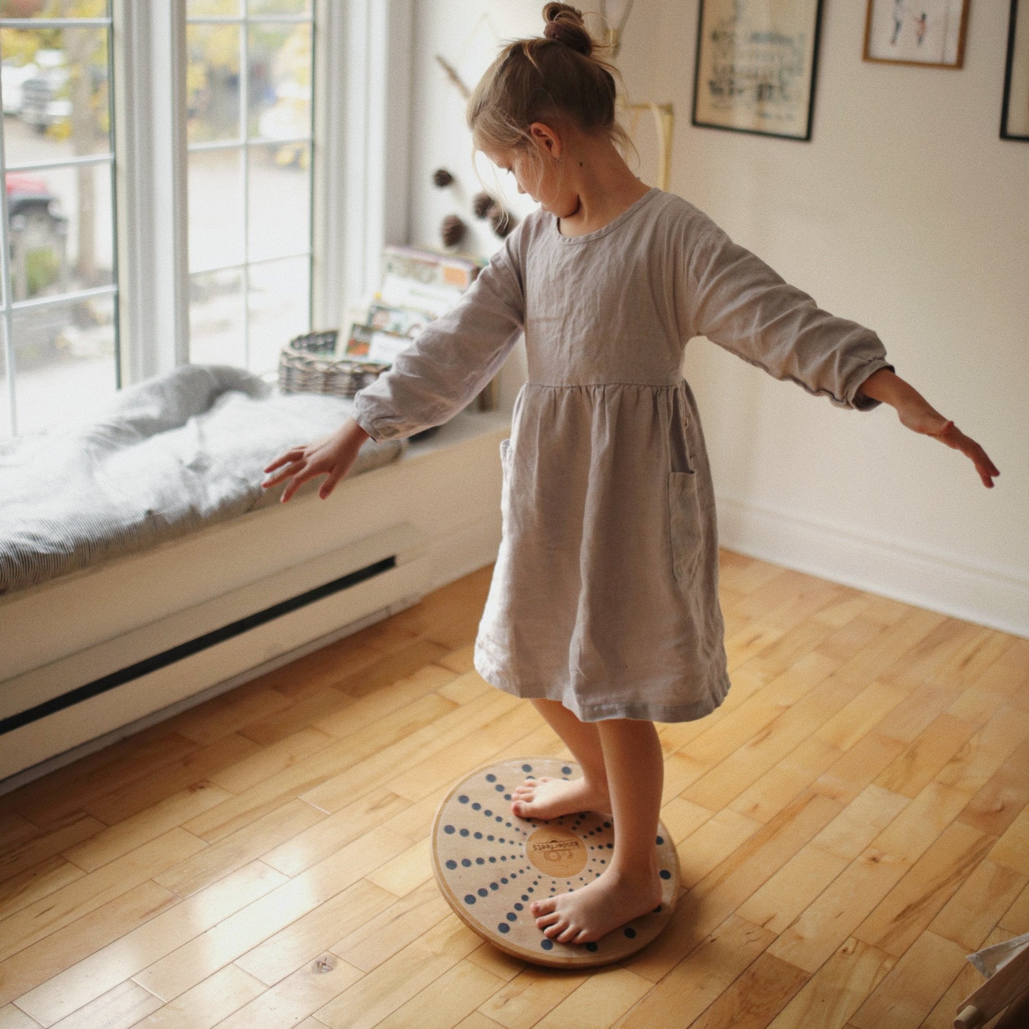 Kinderfeets bamboo balance disc for kids, round and textured, designed for stability and fun indoor or outdoor play.