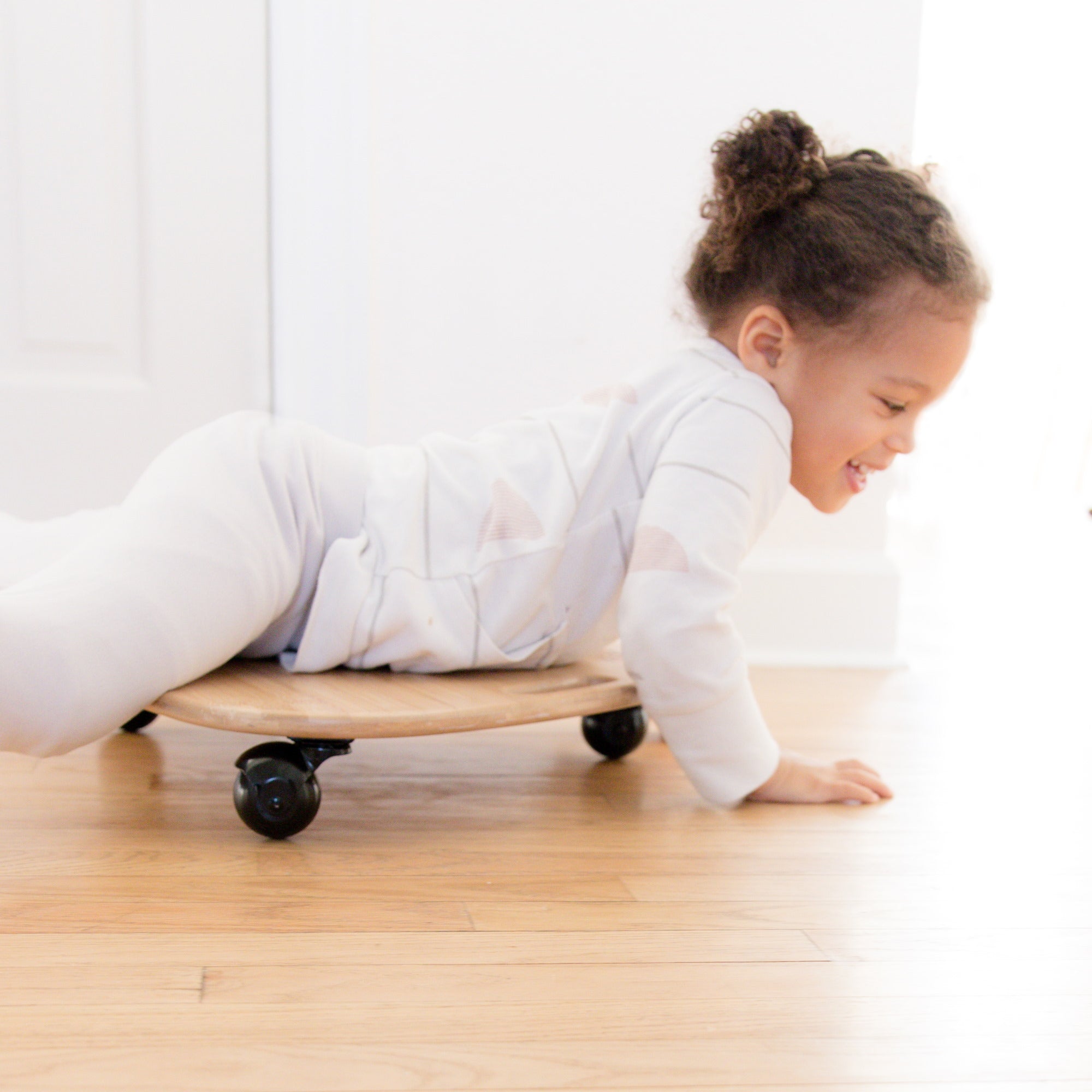 Kinderfeets Tummy Glider toy with colorful, textured surface and child-friendly design for active play and sensory development.
