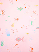 Toshi Baby Swim Nappy in coral, adjustable swim nappy for infants, featuring a secure fit and soft waterproof fabric.