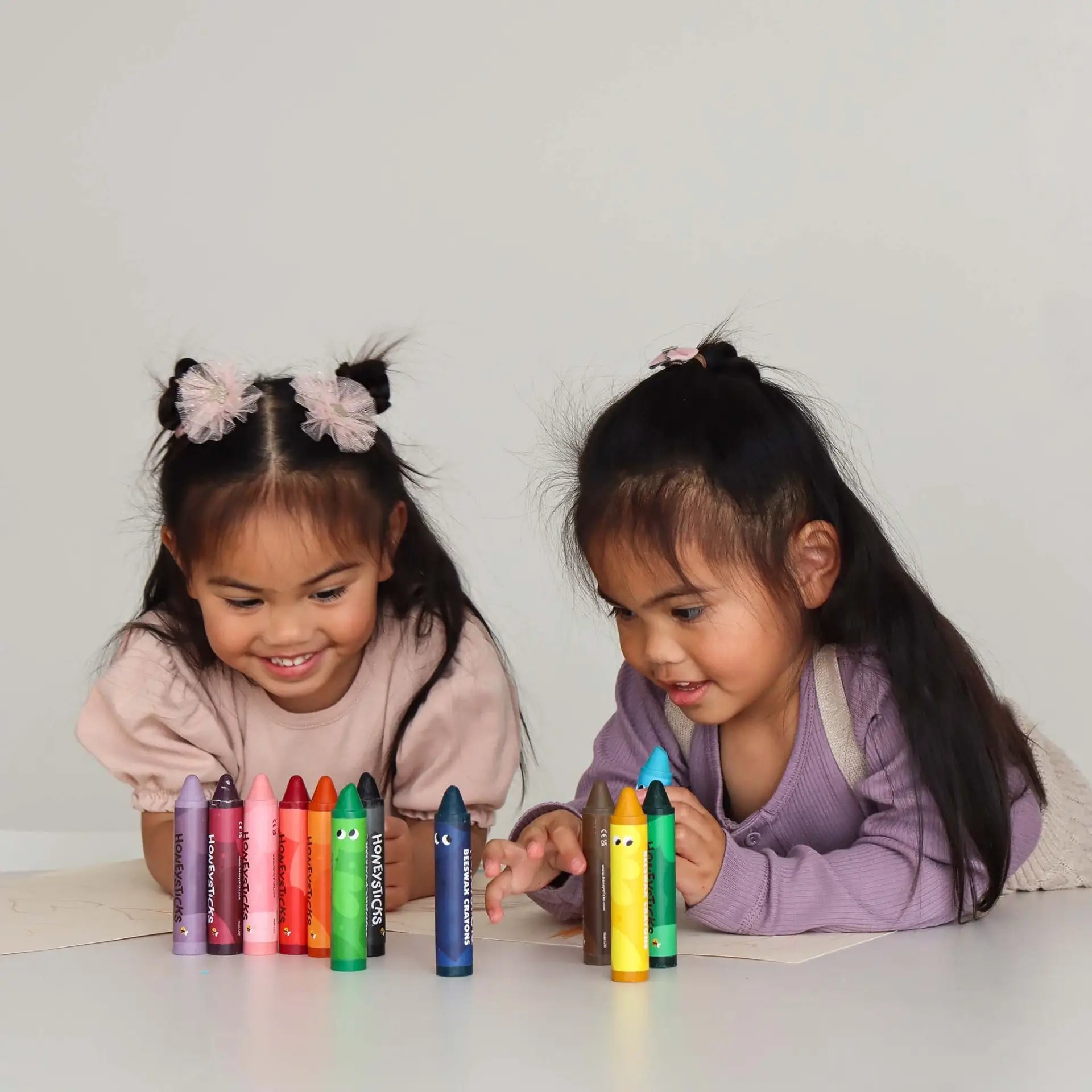 Honeysticks Beeswax Crayons Jumbos 12-pack, natural colorful crayons for children, shown in a close-up image with vibrant hues