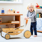 Kinderfeets Cargo Walker wooden toy in white, featuring a classic design with four wheels and a sturdy handle for early walking support.