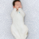 Love to Dream Swaddle Up™ Organic 1.0 TOG in cream, soft swaddle blanket designed for newborn comfort and sleep.