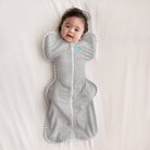 Love To Dream Swaddle Up™ Original 1.0 TOG in grey, a cozy baby swaddle with arms-up design, soft fabric, and breathable material.