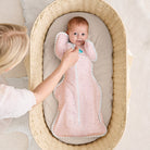 Love to Dream Swaddle Up Lite 0.2 TOG in pink, featuring a soft fabric swaddle with "You Are My" text and gentle design for babies.