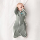 Love to Dream Swaddle Up™ Original 1.0 TOG in olive, showing the soft fabric swaddle with zipper closure for babies.