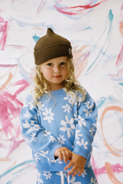 GROWN Organic Wild Flower Knit Jumper, cozy sweater with floral pattern, in natural tones, made from organic materials.