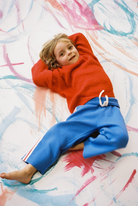 Grown organic textured knit sweater in sauce color, featuring a cozy, stylish pullover with a detailed knit pattern.
