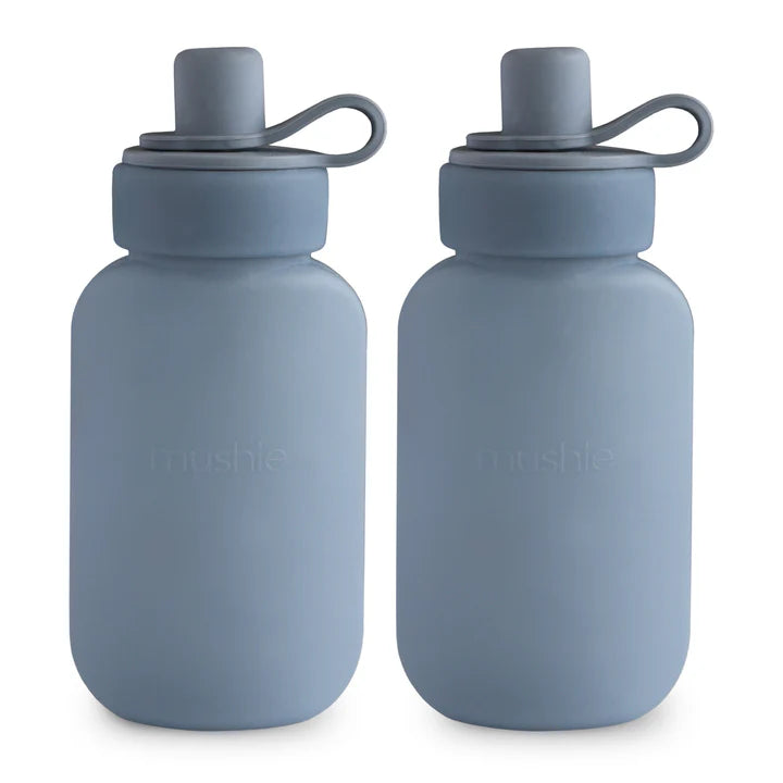 Mushie silicone puree pouch set with two Cambridge Blue reusable dinnerware pouches for baby food storage and feeding.