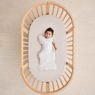 Love to Dream Swaddle Up Transition Bag Lite 0.2 TOG in white, showing the soft fabric and snug fit for baby comfort.