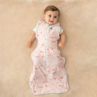 Love to Dream Swaddle Up Transition Bag Lite in Daredevil Bunny Pink, 0.2 TOG, soft fabric with bunny print for baby sleep comfort.