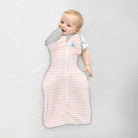 Love to Dream Swaddle Up Transition Bag 1.0 TOG in dusty pink, soft fabric with zipper and shoulder openings for easy swaddling.