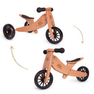 Kinderfeets Tiny Tot trike in coral, a compact balance bike for young children, with a wooden frame and colorful design.