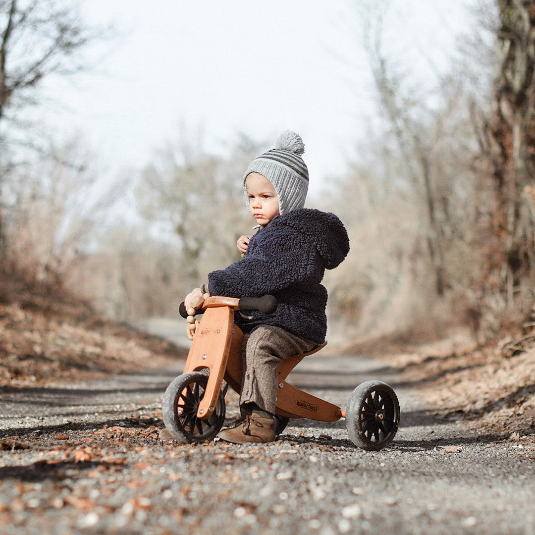 Kinderfeets Tiny Tot Mocha balance bike with bamboo frame, shown from the front, designed for young children learning to ride.