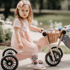 Kinderfeets Tiny Tot Plus pink trike and balance bike for toddlers, with a sturdy wooden frame and colorful wheels.