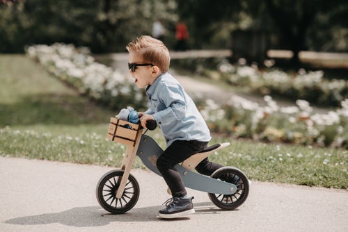 Kinderfeets Tiny Tot Plus slate blue trike and balance bike for toddlers, featuring a sturdy design and comfortable handlebars.
