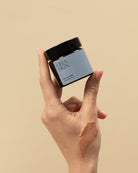 Oria Skin Pink Clay Mask 65g jar with pink-colored clay mask inside, skincare product for face, on a neutral background.