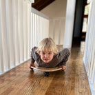 Kinderfeets Tummy Glider toy for children, featuring colorful plastic construction and smooth gliding design.
