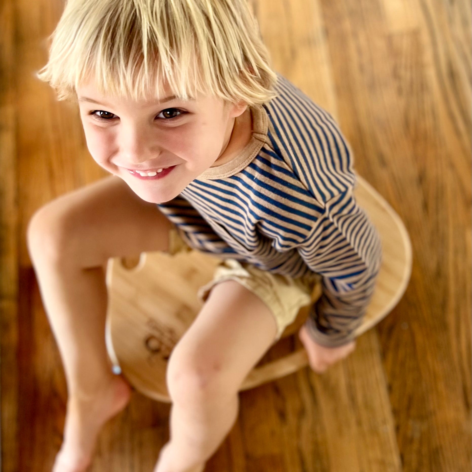 Kinderfeets Tummy Glider toy from the Kinderfeets brand, featuring colorful wooden construction and smooth, rounded edges for children.