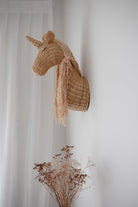 Rattan unicorn wall mount by Inkah Limited featuring a detailed, handcrafted unicorn figure for wall decor.
