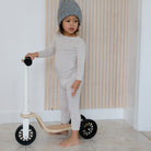 Kinderfeets scooter for kids with wooden deck and colorful wheels, suitable for young children learning to ride.