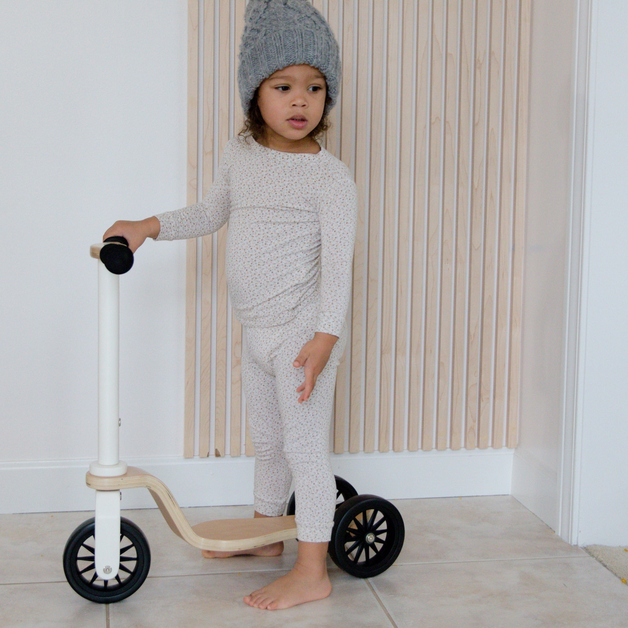 Kinderfeets scooter for kids with wooden deck and colorful wheels, suitable for young children learning to ride.