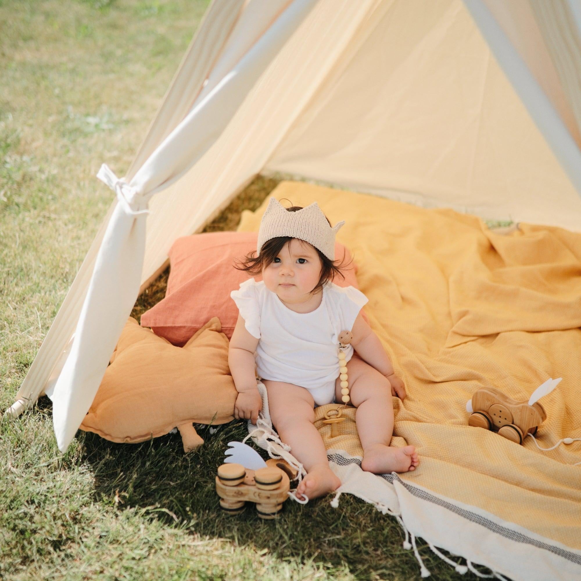 Kinderfeets Play Tent set up with colorful fabric walls and a doorway, designed as a fun indoor play space for children.