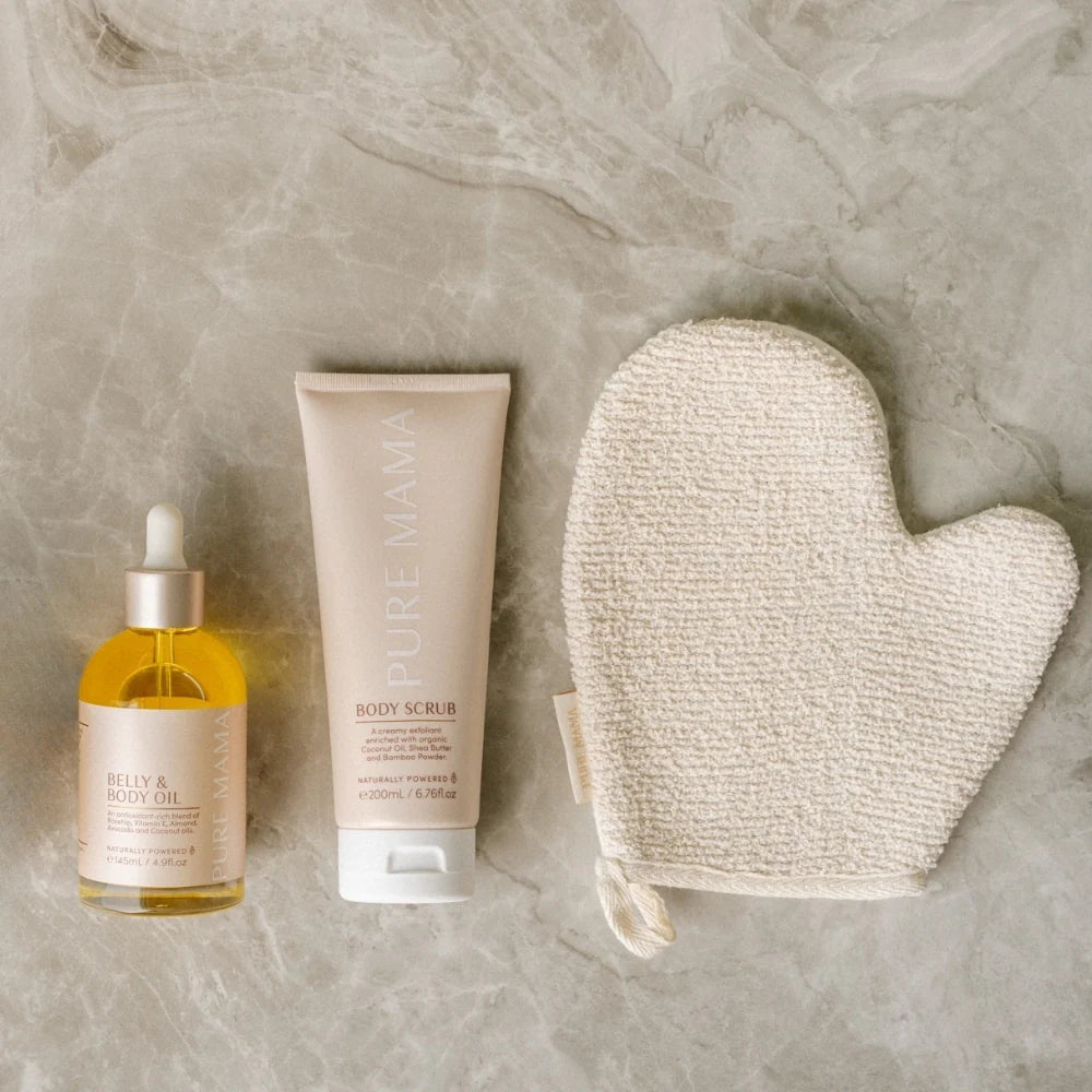 Pure Mama Bump Love Set featuring belly and body oil, scrub, and stretch mark oil for women's skincare and pregnancy care.