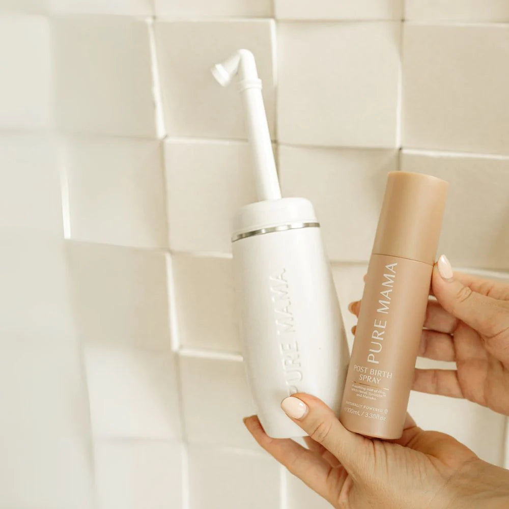 Pure Mama postpartum recovery set with nipple butter, peri wash, nursing pads, and spray for women's post-birth care.